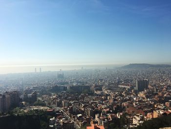 Aerial view of cityscape against clear sky