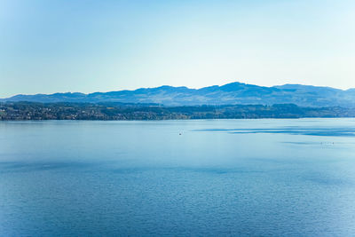 Scenic view of sea against clear blue sky