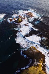 High angle view of rocks in sea