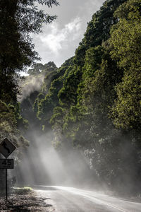 Scenic view of waterfall against sky