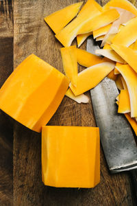 Removing the skin from butternut squash cutting board still life