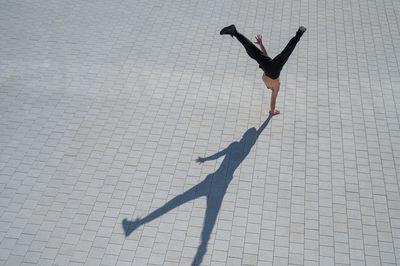 High angle view of man walking on street