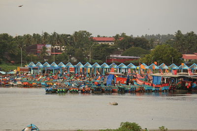 Boats on beach against clear sky