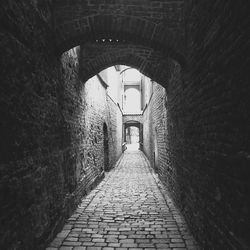 Narrow walkway leading to tunnel