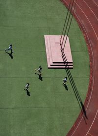 High angle view of people playing soccer on field