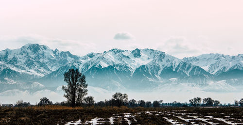 Scenic view of snowcapped mountains against sky