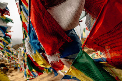 Low angle view of multi colored flags hanging