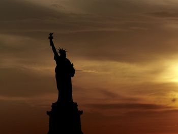 Low angle view of statue against sky