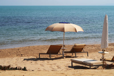 Umbrella and chairs at beach