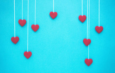 Heart shape made on blue colored background