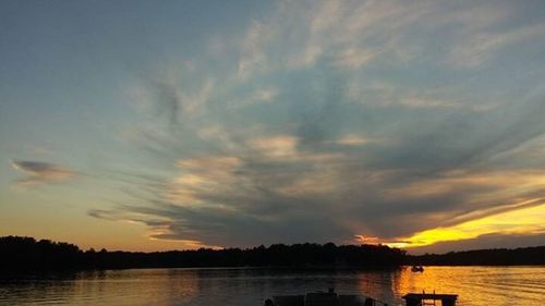 Scenic view of lake at sunset