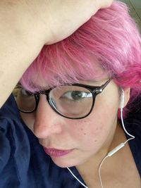 Close-up portrait of woman wearing eyeglasses