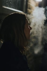 Portrait of young woman smoking