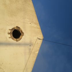 Low angle view of bell tower against sky