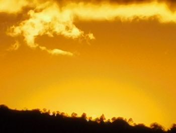 Low angle view of dramatic sky during sunset