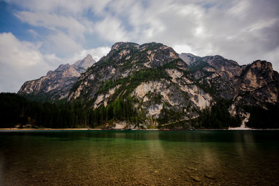 Scenic view of lake and mountains against sky