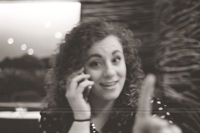 Close-up of young woman using mobile phone