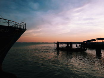 Silhouette pier on sea against sky during sunset