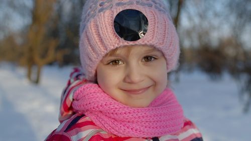 Portrait of cute girl outdoors during winter