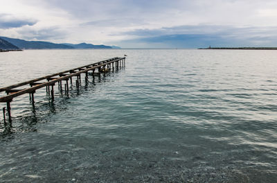 Pier over sea against sky