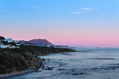 Scenic view of sea against clear sky during sunset