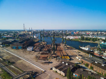 High angle view of cityscape against clear blue sky