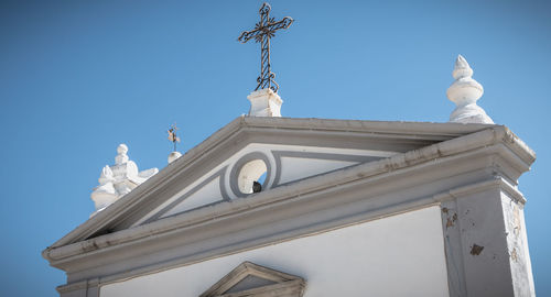 Low angle view of traditional building against clear blue sky