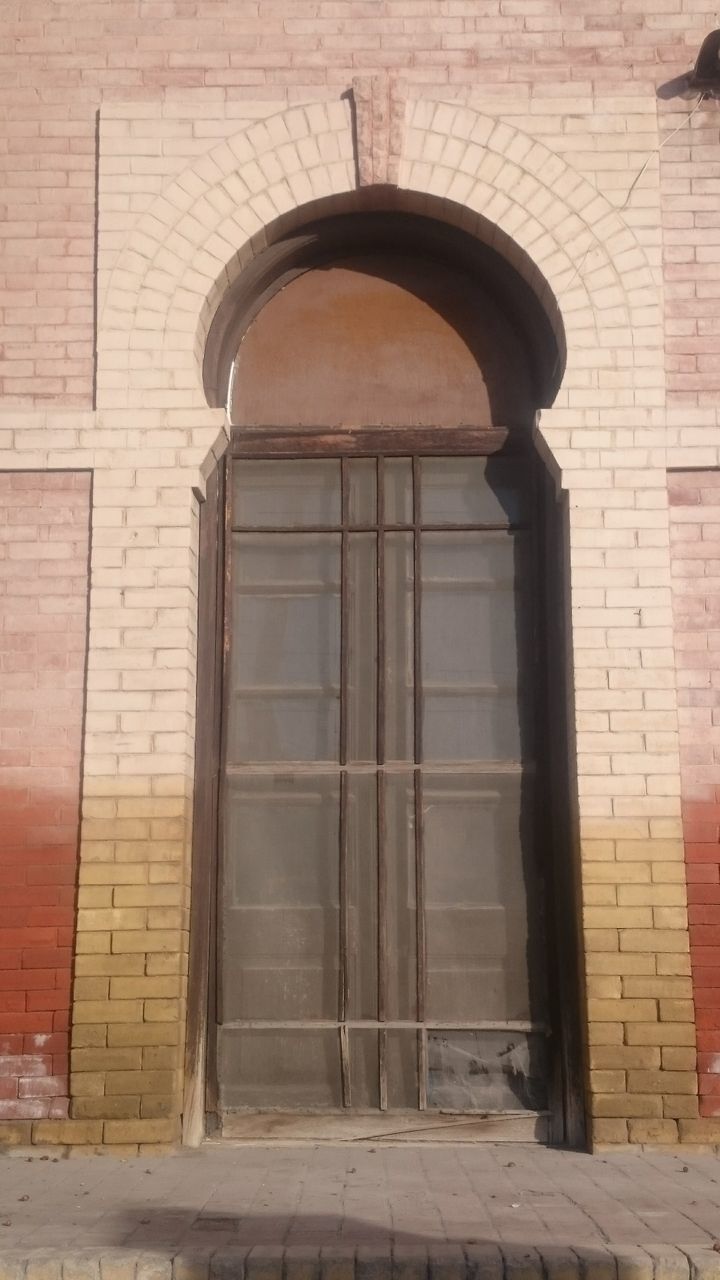 CLOSED DOOR OF STONE BUILDING