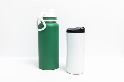 Close-up of bottles against white background
