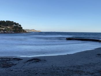 Scenic view of sea against clear sky