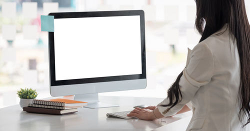 Woman using laptop on table