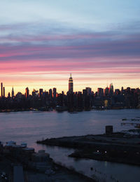 Buildings in city at sunset