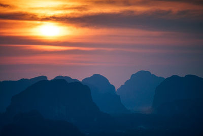 Scenic view of mountains against sky during sunset