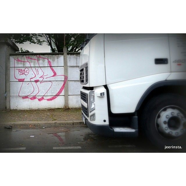 transfer print, auto post production filter, transportation, built structure, architecture, wall - building feature, building exterior, car, close-up, wall, day, land vehicle, mode of transport, door, communication, graffiti, old, street, metal, no people