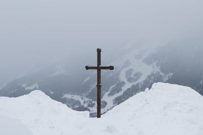 Scenic view of snow covered mountains against sky