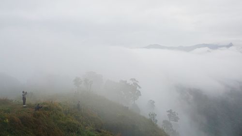 Scenic view of mountains in foggy weather