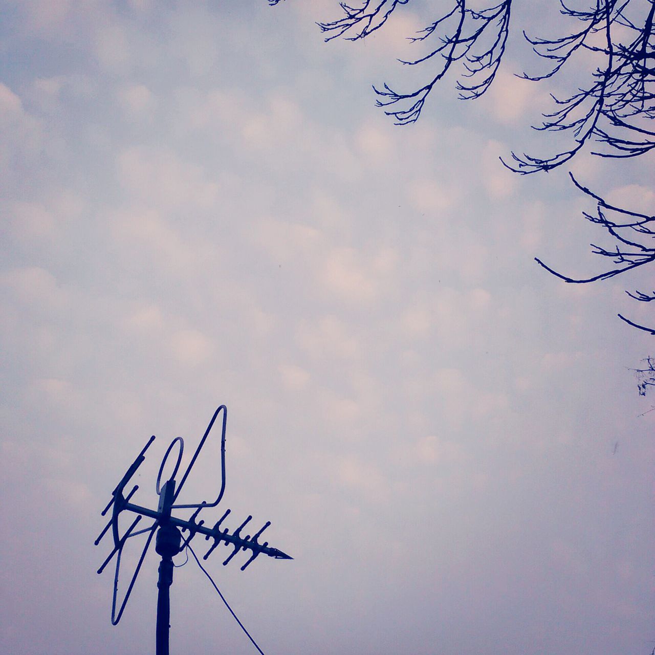 low angle view, sky, silhouette, cloud - sky, fuel and power generation, cloudy, cloud, technology, electricity, environmental conservation, dusk, nature, outdoors, no people, alternative energy, tranquility, wind turbine, wind power, electricity pylon, day