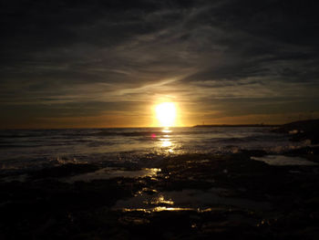 Scenic view of sea at sunset