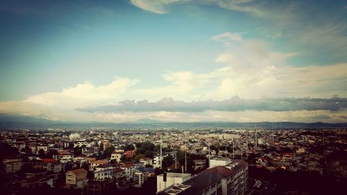 Aerial view of town against sky
