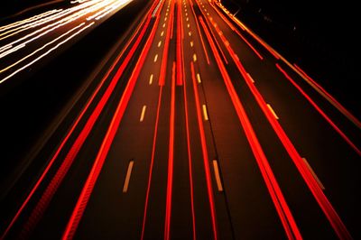 Close-up of light trails on road at night