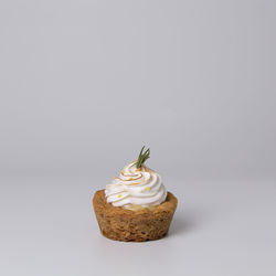 Close-up of cupcakes against white background