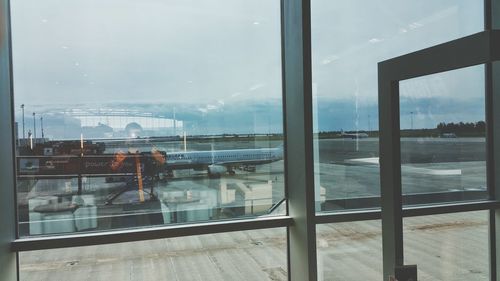 Reflection of clouds in glass on wall