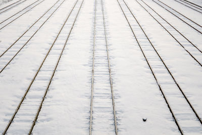 High angle view of snow covered railroad tracks