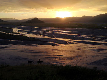 Scenic view of sunset over landscape