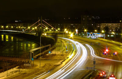 High angle view of light trails on road at night