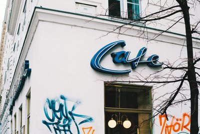 Low angle view of text on building