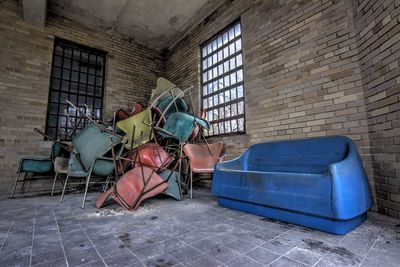 Interior of abandoned building with scrap furniture