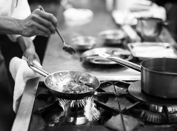 Midsection of man preparing food