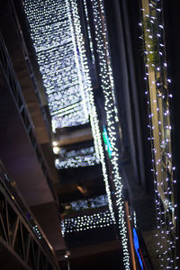 Low angle view of illuminated lights at night