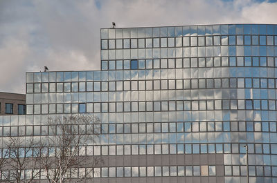 Low angle view of modern buildings against sky